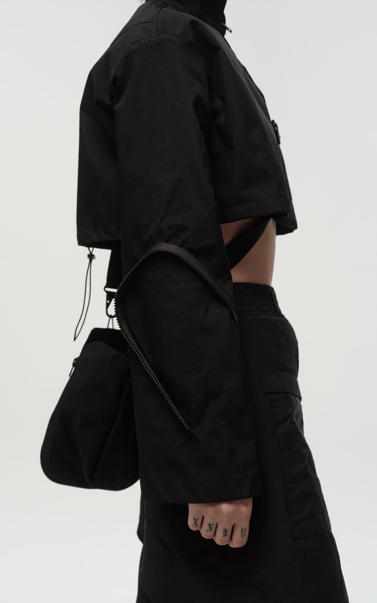 1. "REI" 3L Waterproof Cropped Jacket with Removable Bag