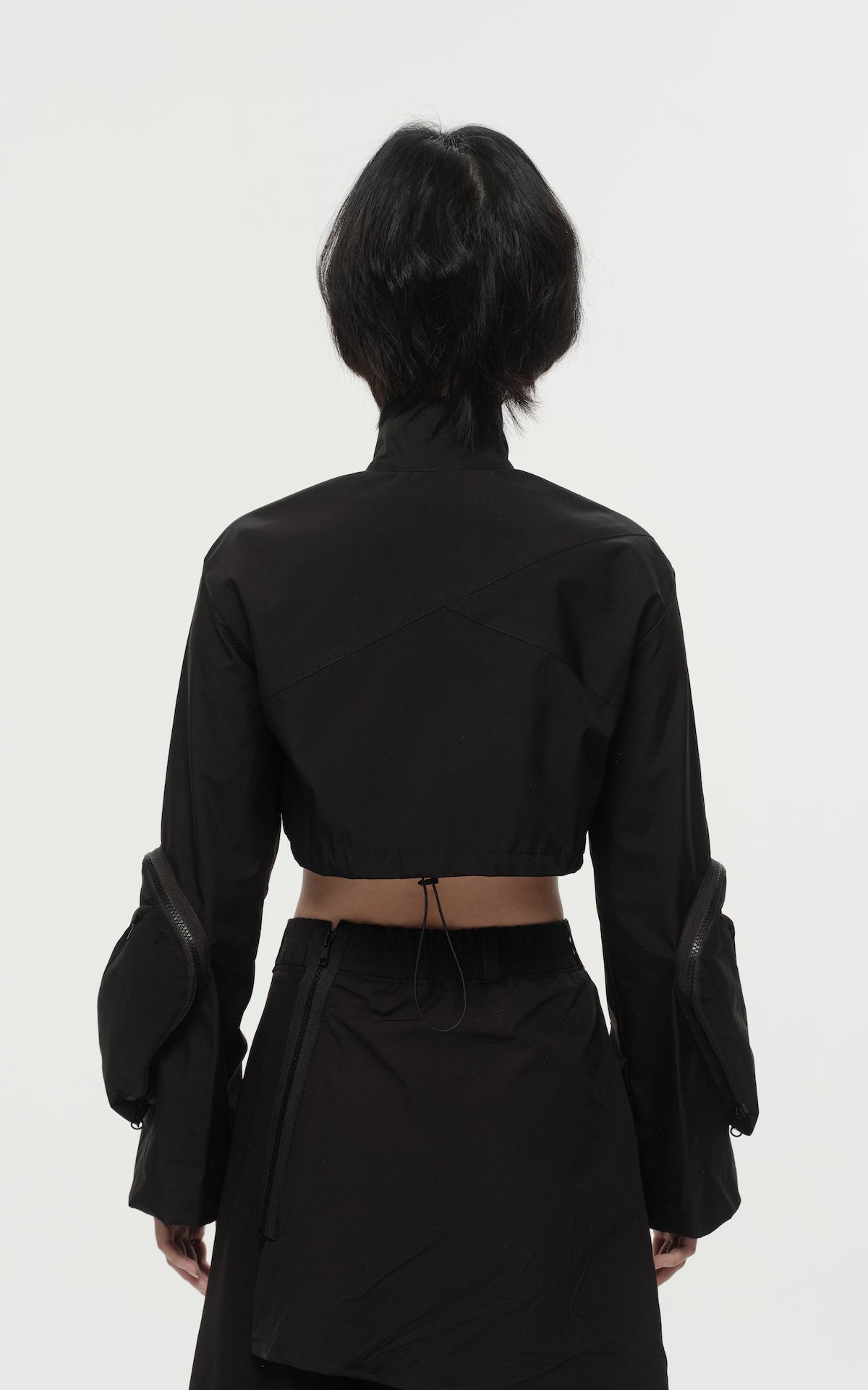 1. "REI" 3L Waterproof Cropped Jacket with Removable Bag