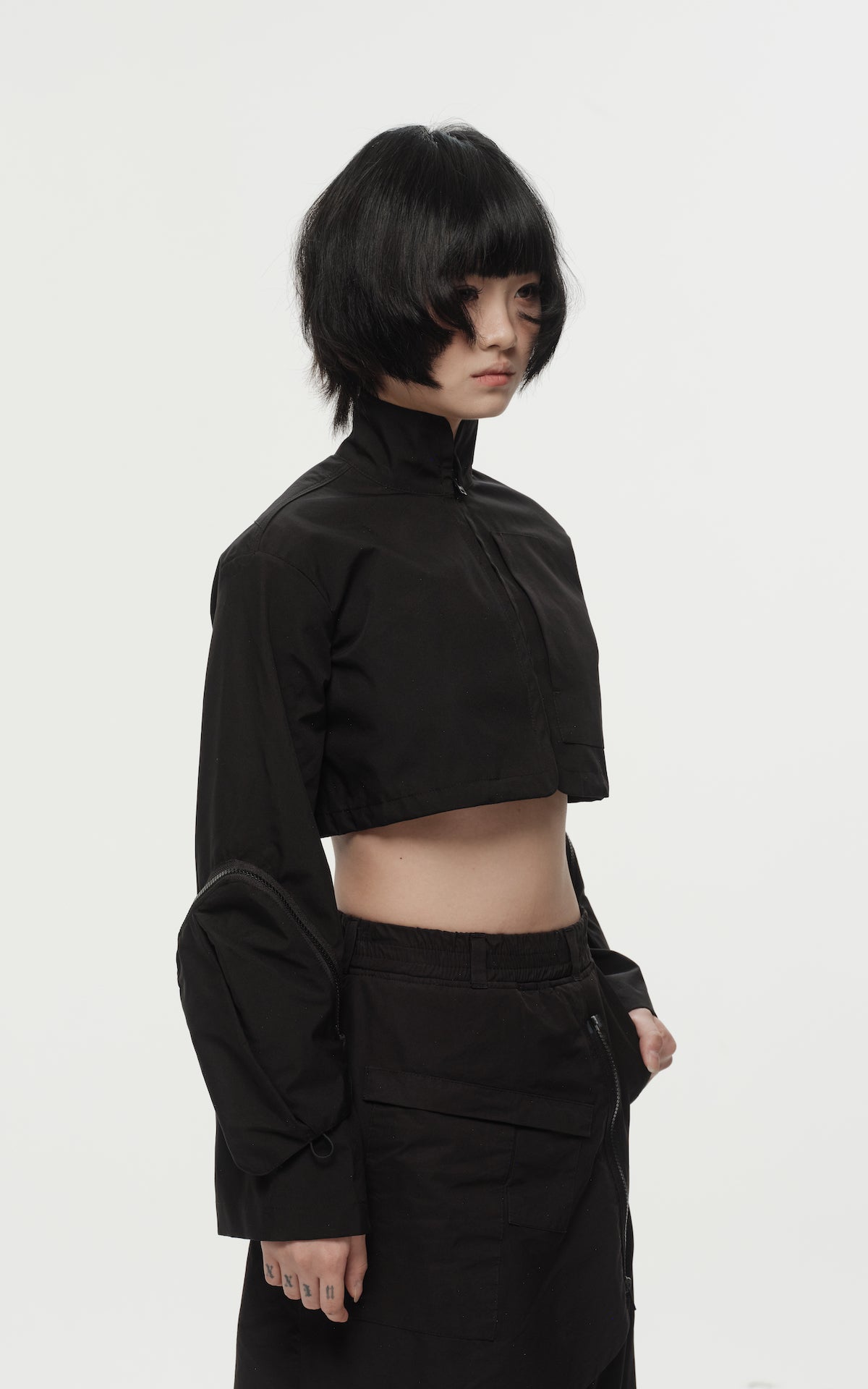 1. "REI" 3L Waterproof Cropped Jacket with Removable Bag