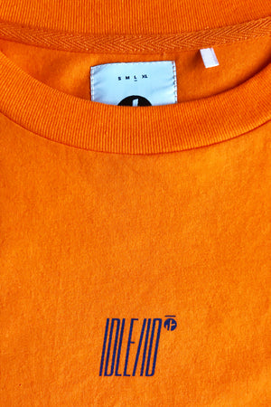 2. "Progression" Orange Tee